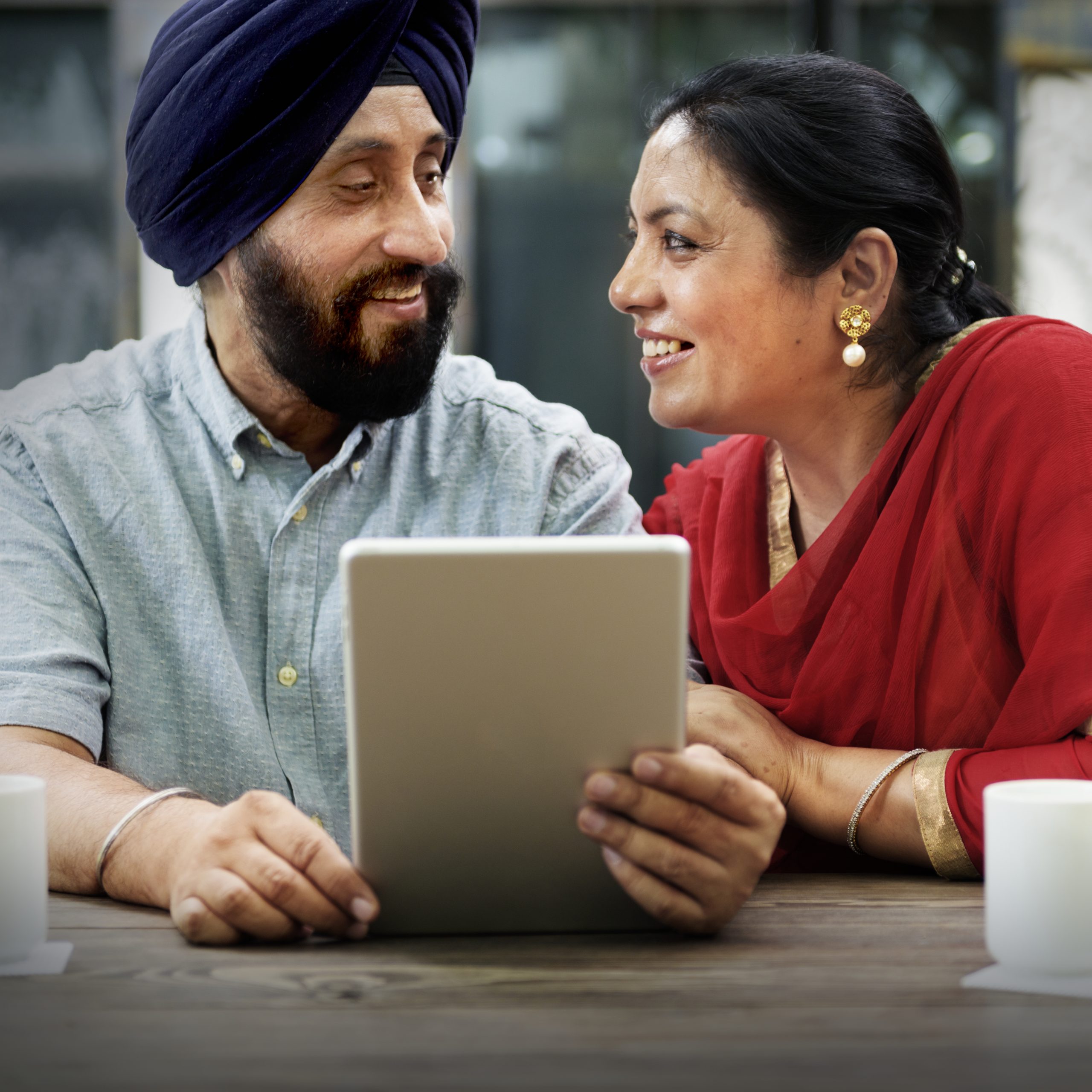 Indian Couple Using Device Concept